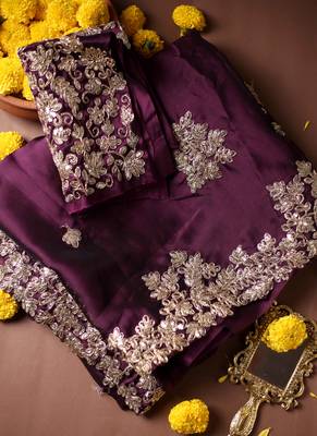 Purple embroidered chiffon saree. 1
