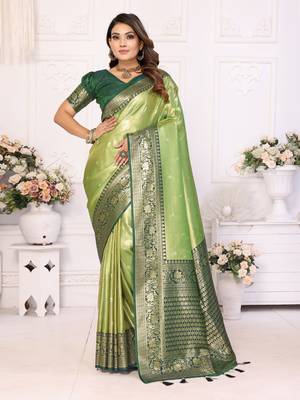 Green faux banarasi tissue silk blend woven zari heavy saree 1