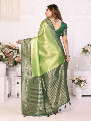 Green faux banarasi tissue silk blend woven zari heavy saree 2