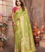 Green graceful soft silk blend saree with woven zari work