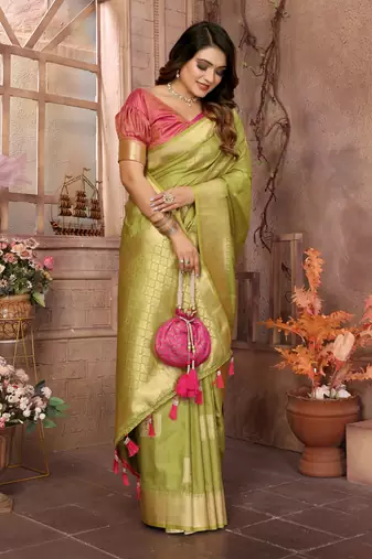 Green graceful soft silk blend saree with woven zari work
