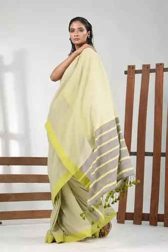 Tea green cotton soft saree with solid pattern