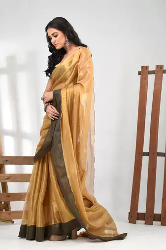 Golden tissue soft saree with pompom