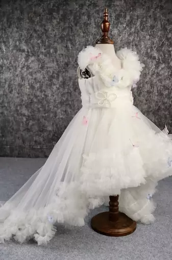 Butterfly net off white trail dress with matching bow hair clip