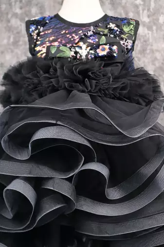 Beautiful ruffle net black gown with drape
