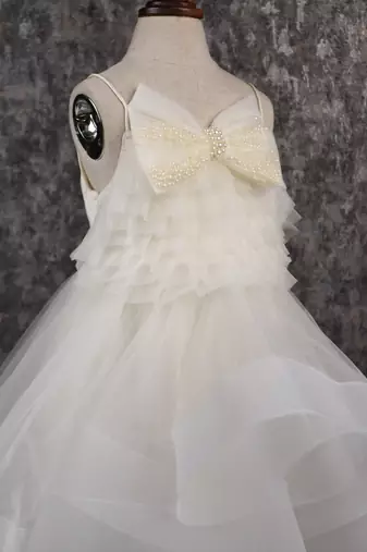 Stylish off white trail dress with bowie pearl string hair clip