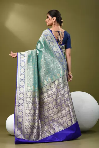 Teal  banarasi brocade saree with zari woven ethnic designs