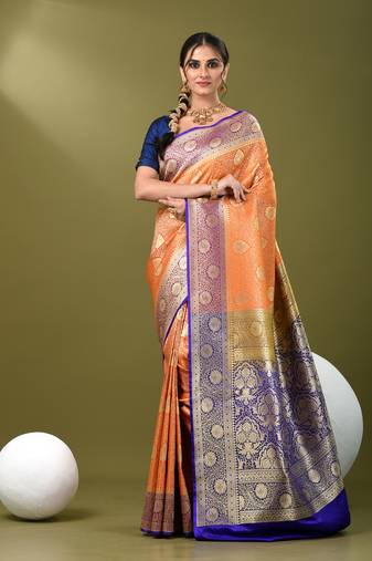 Orange  banarasi brocade saree with zari woven ethnic designs