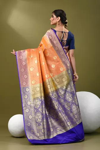 Orange  banarasi brocade saree with zari woven ethnic designs