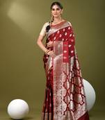 Maroon katan silk blend banarasi saree with zari woven ethnic designs