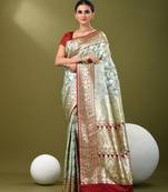 Light teal katan silk blend banarasi saree with zari woven ethnic designs