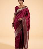 Maroon Banarasi Silk blend Saree with Intricate Silver Zari Work