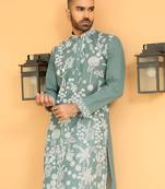 Ethnic motifs embroidered georgette green kurta with trouser pant