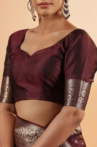 maroon banarasi art silk saree with silver zari buti & ornate border