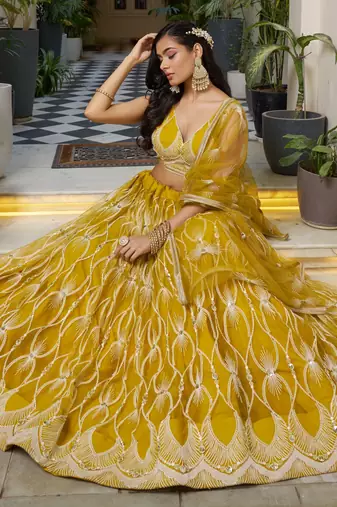 mustard yellow embroidered net haldi lehenga set choli with dupatta