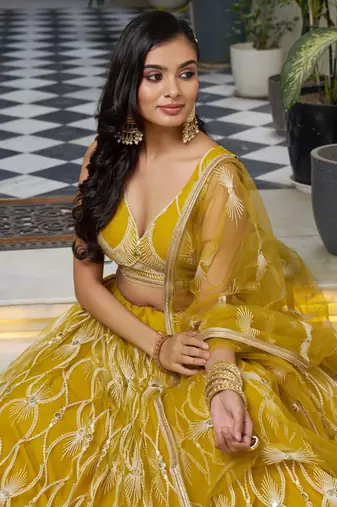 mustard yellow embroidered net haldi lehenga set choli with dupatta
