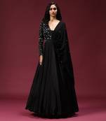 Black gown embellished with pearl and cutbeads