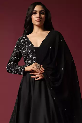 Black gown embellished with pearl and cutbeads