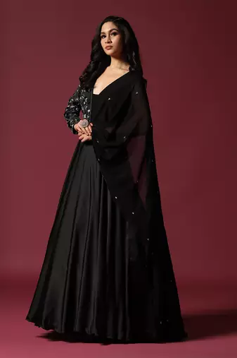 Black gown embellished with pearl and cutbeads