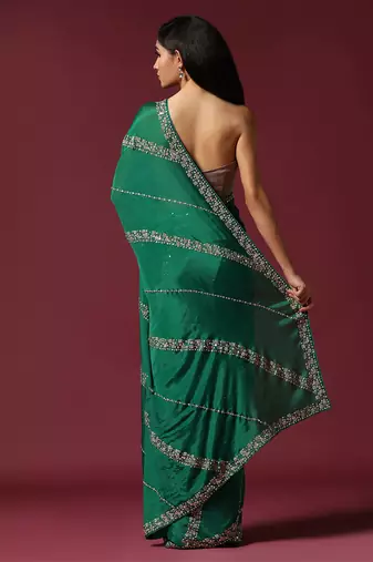Green embroidered & embellished saree