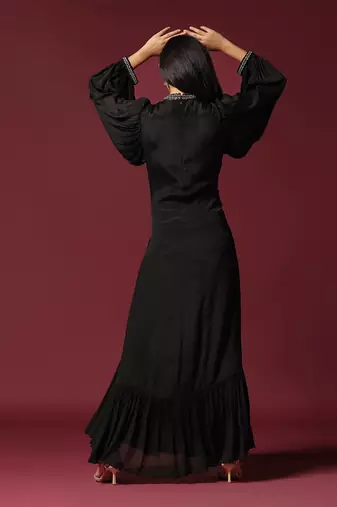 Black gown embellished with pearls and antique silver cutbeads with belt