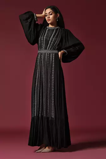 Black gown embellished with pearls and antique silver cutbeads with belt