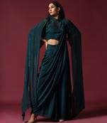 Teal green pre-draped saree with a shoulder cape