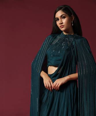 Teal green pre-draped saree with a shoulder cape 2