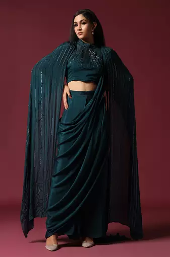 Teal green pre-draped saree with a shoulder cape