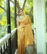 Women's yellow tussar silk leheriya print with zari border saree with blouse