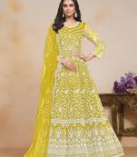 Yellow ceremonial net floor length salwar kameez