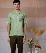 Green hand embroidered linen shirt - tropical leaf