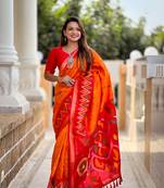 Orange art silk ikkat and patola weaving concept saree with contrast blouse