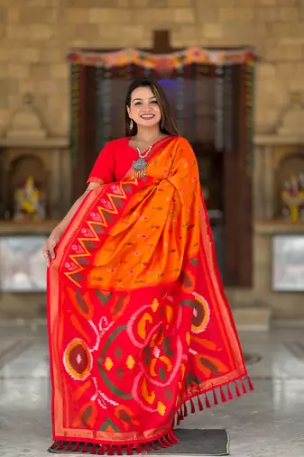 Orange art silk ikkat and patola weaving concept saree with contrast blouse