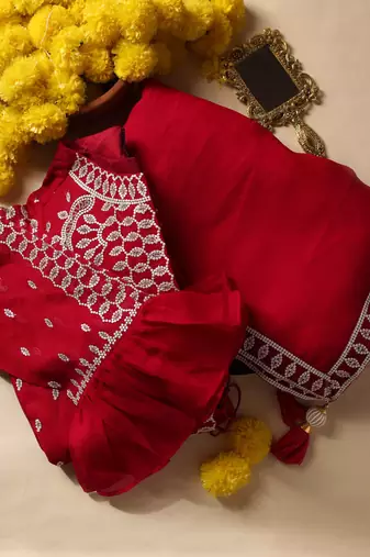 Crimson designer saree with jacket style ready blouse.