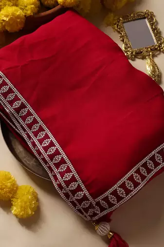 Crimson designer saree with jacket style ready blouse.