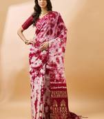 Red staple cotton saree with tie-dye pattern, golden zari woven