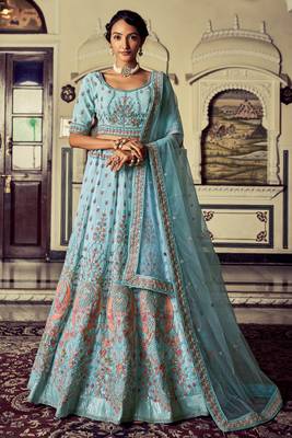 Aqua color heavy embroidered lehenga choli set. 1