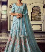 Aqua color heavy embroidered lehenga choli set.