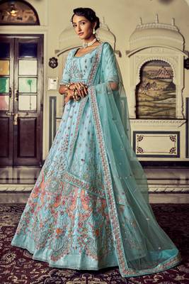 Aqua color heavy embroidered lehenga choli set. 2