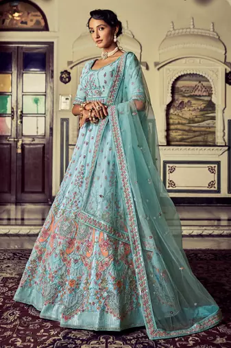 Aqua color heavy embroidered lehenga choli set.