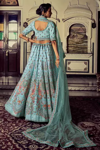Aqua color heavy embroidered lehenga choli set.