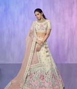 white heavy work lehenga with vibrant blouse and contrast dupatta