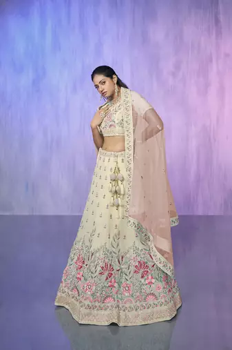 white heavy work lehenga with vibrant blouse and contrast dupatta