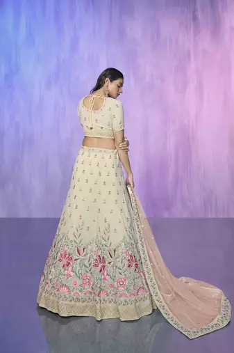 white heavy work lehenga with vibrant blouse and contrast dupatta
