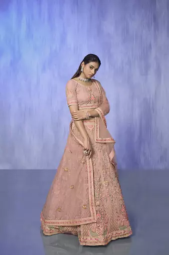peach heavy work lehenga with vibrant blouse and matching dupatta