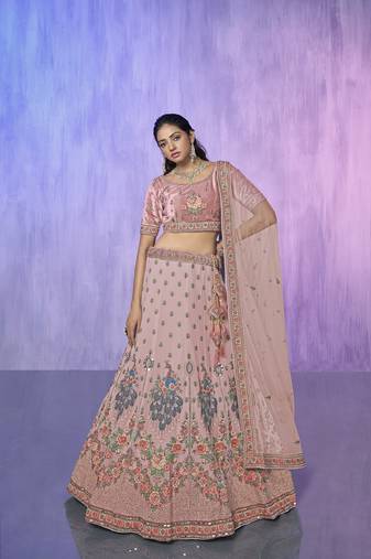peach heavy work lehenga with vibrant blouse and contrast dupatta