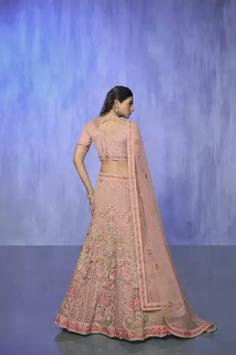 peach heavy work lehenga with vibrant blouse and matching dupatta