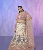 white heavy work lehenga with vibrant blouse and contrast dupatta