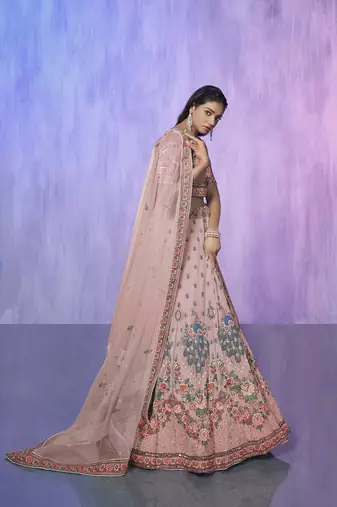 peach heavy work lehenga with vibrant blouse and contrast dupatta